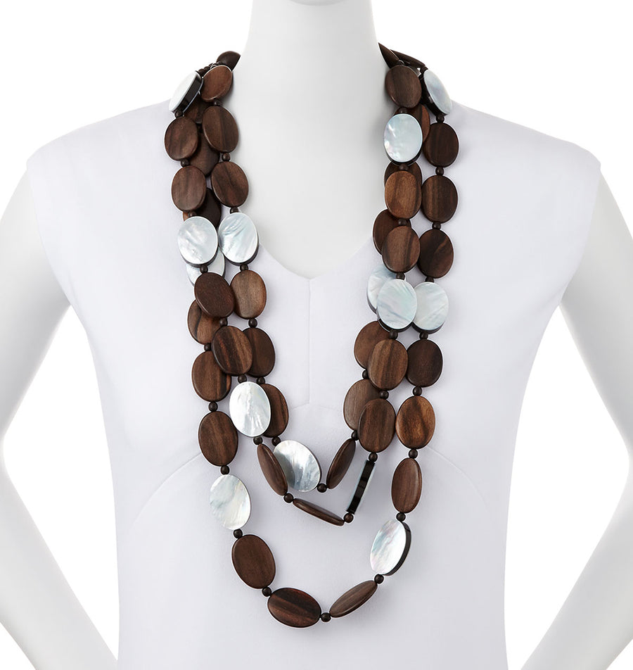 TRIPLE STRAND WOOD AND MOP NECKLACE. WOOD/SILVER MOP