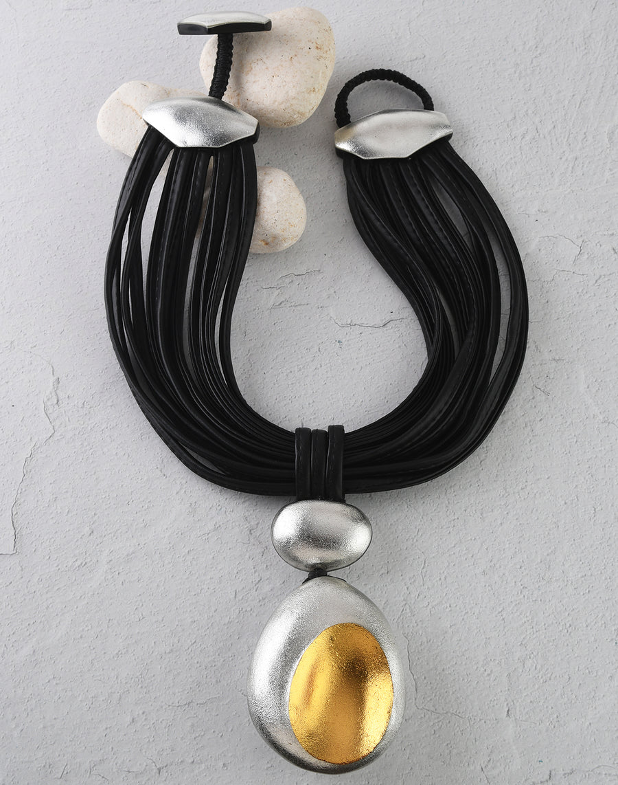 RIO PENDANT ON LEATHER NECKLINE. BLACK/SILVER/GOLD